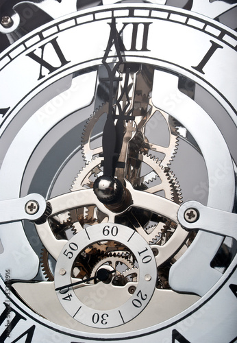 Photo: Clock showing time one minute before midnight Clock showing time one minute before midnight