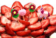 four childish candles on a strawberry birthday cake