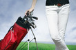 Women standing by golf bag full of sticks Women standing by golf bag full of sticks