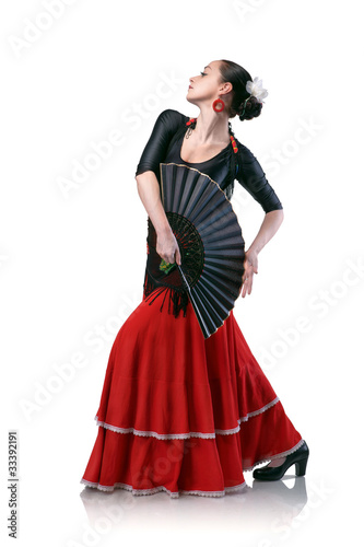 young woman dancing flamenco with fan isolated on white