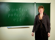 Photo: teacher against blackboard background teacher against blackboard background