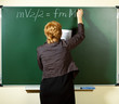 Photo: math teacher writing formula on the blackboard math teacher writing formula on the blackboard