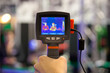 noncontact infrared thermometer in hand