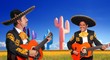 Mexican mariachi charro playing guitar in cactus Mexican mariachi charro playing guitar in cactus