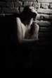 Portrait of girl in a corset at a wall Portrait of girl in a corset at a wall