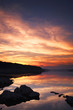 silhoette on tje reflection of sunset