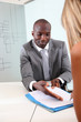 Businessman having client signing contract Businessman having client signing contract