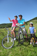 Photo: Family on a mountain bike ride in summer Family on a mountain bike ride in summer