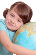 Little girl with globe