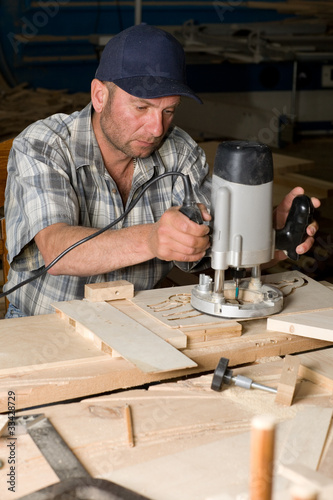 Photo: Carpenter in the woodworking shop Carpenter in the woodworking shop