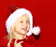 Mädchen mit Weihnachtsmütze Mädchen mit Weihnachtsmütze
