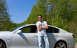 Young man portrait with car