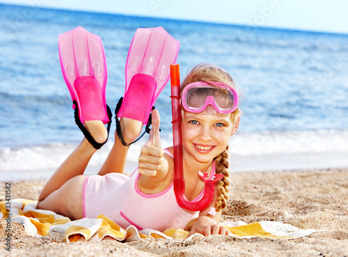 Photo: Child playing on beach. Child playing on beach.