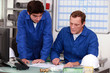 Workers discussing a drawing