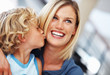 Boy kissing mother
