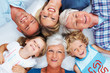 Happy three generation family lying down together