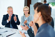 Business people applauding for good presentation Business people applauding for good presentation