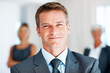 Handsome business man with group