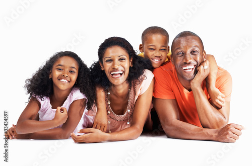 Photo: Cheerful couple smiling with two children Cheerful couple smiling with two children