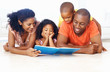 Photo: African American family reading book together African American family reading book together