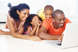 African American family using laptop