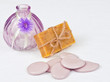Bar of herbal soap with stones and a vase