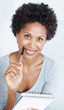 Lovely woman writing on notepad