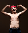 Funny nerd showing his biceps