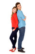 Happy couple standing back to back Happy couple standing back to back