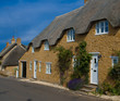 Row of thatched cottages in Abbotsbury, Dorset, England