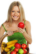 woman holds a basket of fruit