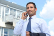 Estate agent stood outside property