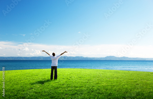 Photo: happy young man in sunset time and sea happy young man in sunset time and sea