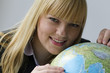 Photo: Junge Frau mit Globus Junge Frau mit Globus