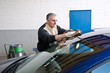 Man cleaning a car.