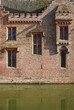 Reflection of the wall in the moat.
