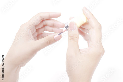 Photo: Close up view of painting nail on white background Close up view of painting nail on white background
