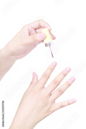 Photo: Close up view of painting nail on white background Close up view of painting nail on white background
