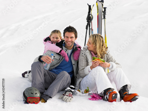 Photo: Young Family With Picnic On Ski Vacation Young Family With Picnic On Ski Vacation