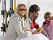 Young Family Sharing A Picnic On Ski Vacation