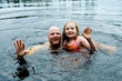 Family fun swimming in a lake