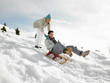 Young Couple Sledding