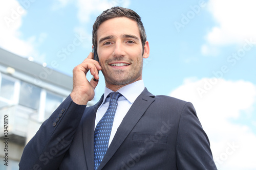 Photo: Confident salesman stood outside Confident salesman stood outside