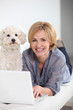 at home laptop, with pet dog