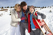 Young Family On Winter Vacation