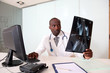 Portrait of doctor checking on X-ray results