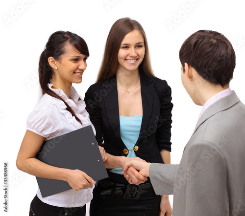 Photo: Business people shaking hands, finishing up a meeting Business people shaking hands, finishing up a meeting