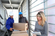 Photo: Businesswoman in warehouse controlling goods reception Businesswoman in warehouse controlling goods reception