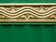 Golden ornament on Green