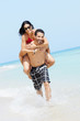 piggyback ride with happy man and woman